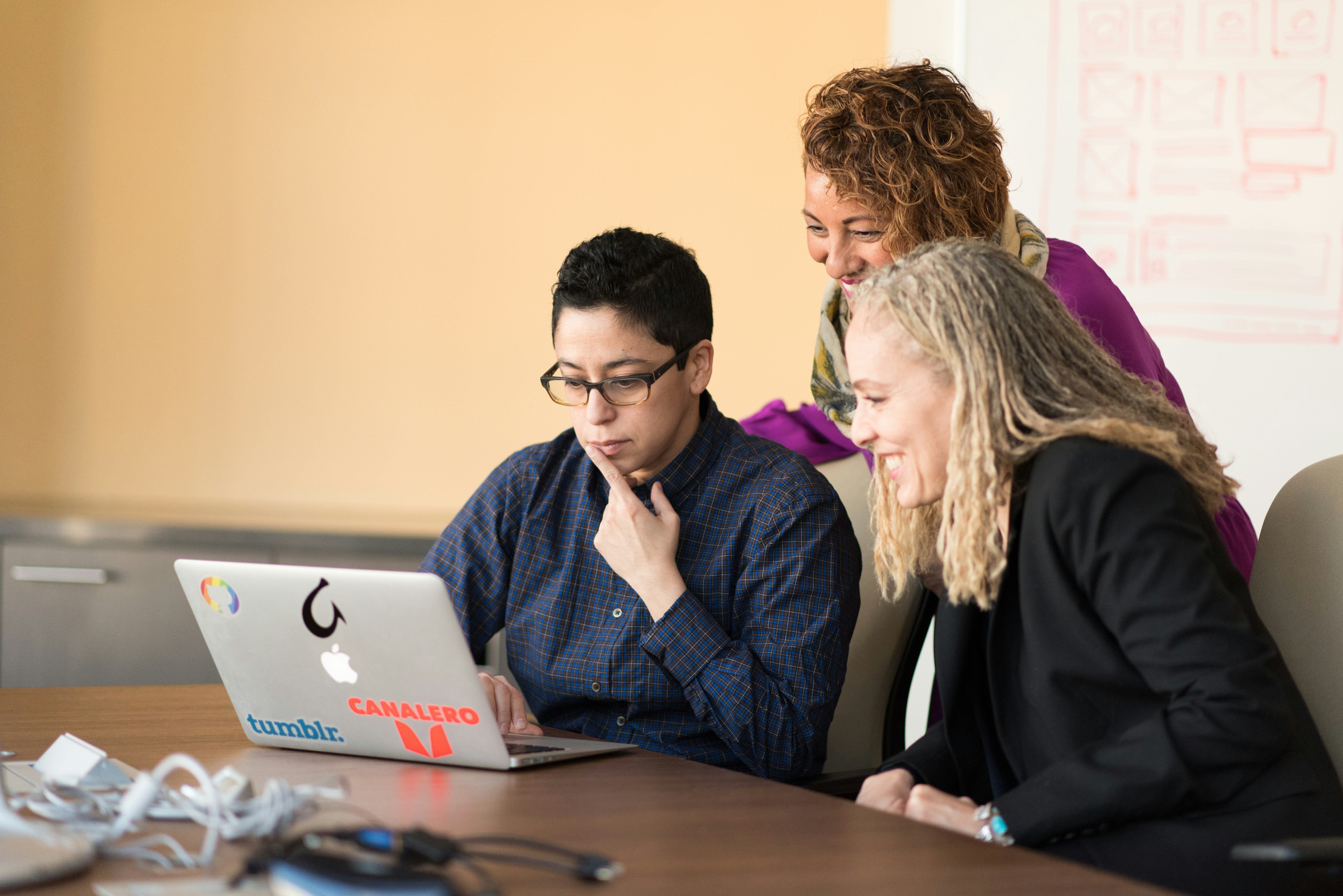 Woman using laptop - Customer Lifecycle Management Software